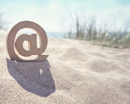 E-mail @ symbol at the beach